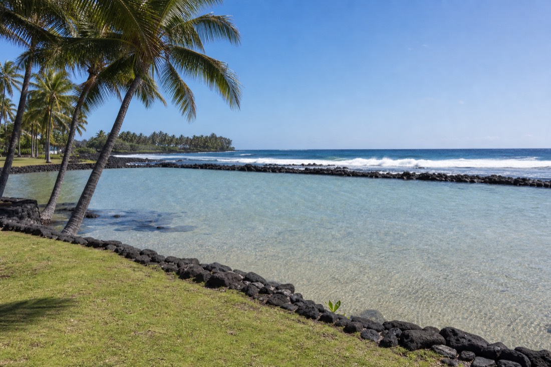 The seawall-protected shallow lagoon at Onekahakaha Beach Park