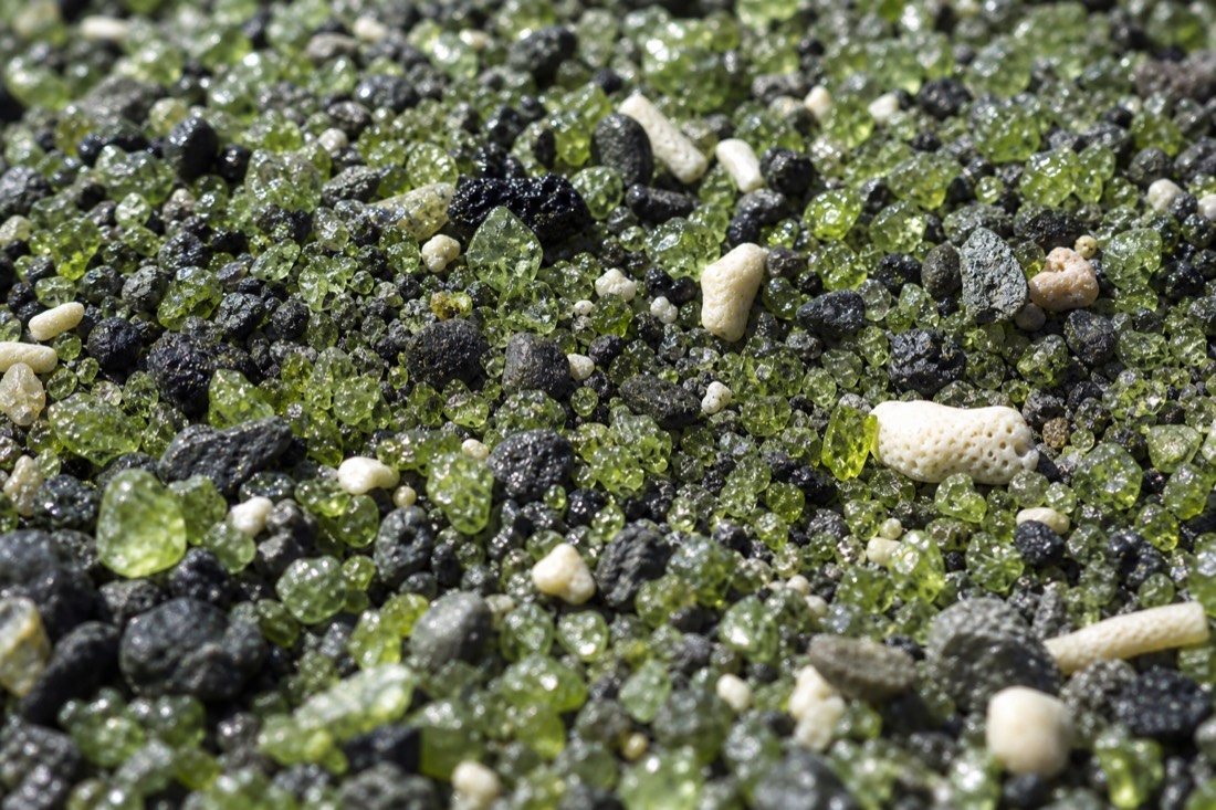 Close-up of the olivine crystals that give Papakōlea its green color
